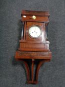 An early 20th century mahogany cased continental bracket clock with shelf.