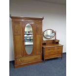 A late Victorian inlaid mahogany mirror door wardrobe, fitted drawer beneath,