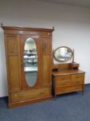 A late Victorian inlaid mahogany mirror door wardrobe, fitted drawer beneath,