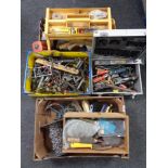 Two boxes, an aluminium crate and a caddy containing assorted hand tools, hardware, chains etc.