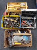 Two boxes, an aluminium crate and a caddy containing assorted hand tools, hardware, chains etc.