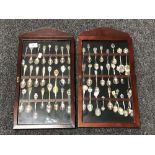 Two spoon display cases containing a quantity of continental silver and plated teaspoons.