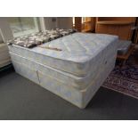 A Kozee sleep 5' storage divan set together with extra mattress