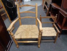 Two 20th century beech framed rush seated chairs.