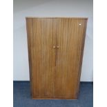 A mid 20th century teak double door wardrobe.