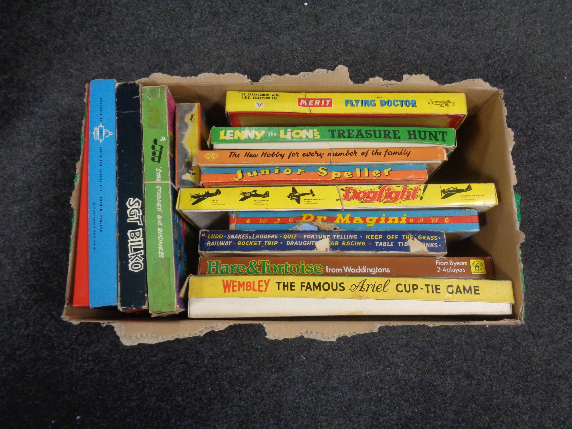 A box containing vintage board games to include Wembley, Flying Doctor, Wells Fargo, etc.