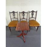 A set of three Edwardian mahogany dining chairs upholstered in golden dralon together with a