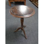 A 19th century pedestal wine table.