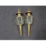 A pair of early 20th century brass Coach lamps with etched glass panels.