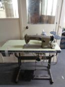 A Brother industrial sewing machine in table.