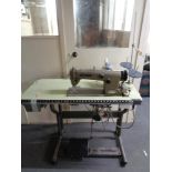 A Brother industrial sewing machine in table.