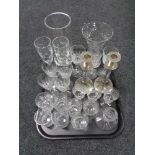 A tray containing assorted glassware to include silver plated glass stemmed candlesticks, vases,