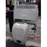 A dehumidifier together with a panel heater.