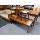 A mid century teak coffee table together with a walnut table,