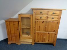 A contemporary pine cabinet, fitted cupboards and four drawers,