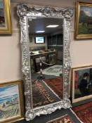 A silvered floor standing mirror 2 m x 1 m