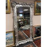 A silvered floor standing mirror 2 m x 1 m