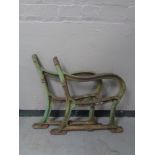 A pair of cast iron garden bench ends