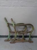 A pair of cast iron garden bench ends