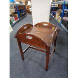 A square butler's tray on stand.