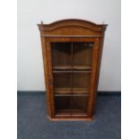 A yew wood hanging corner display cabinet.