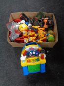 A box containing toys to include Transformers, Action Man, a Sinclair computer joystick.