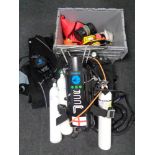 A large quantity of diving equipment to include tanks, regulators, diver's knife, weights,