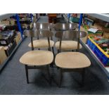 A set of four painted mid 20th century dining chairs.