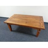 A contemporary hardwood coffee table.