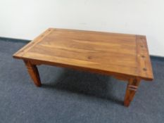 A contemporary hardwood coffee table.