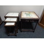 A nest of three tile topped barley twist leg tables,