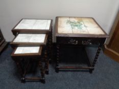 A nest of three tile topped barley twist leg tables,