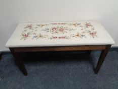 A tapestry upholstered duet stool.