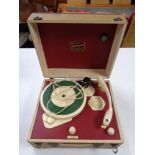 A portable broadcaster Gramette record player.