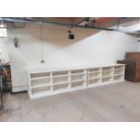 A pair of white painted bookshelves,