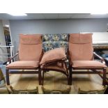 A late twentieth century pair of stained beech armchairs with footstools CONDITION