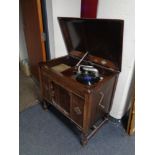 An early 20th century Gilbert gramophone in oak cabinet.