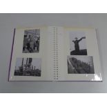 An album containing reprroduction World War II black and white military photographs.