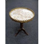 A French style mahogany marble topped wine table with brass gallery and mounts.