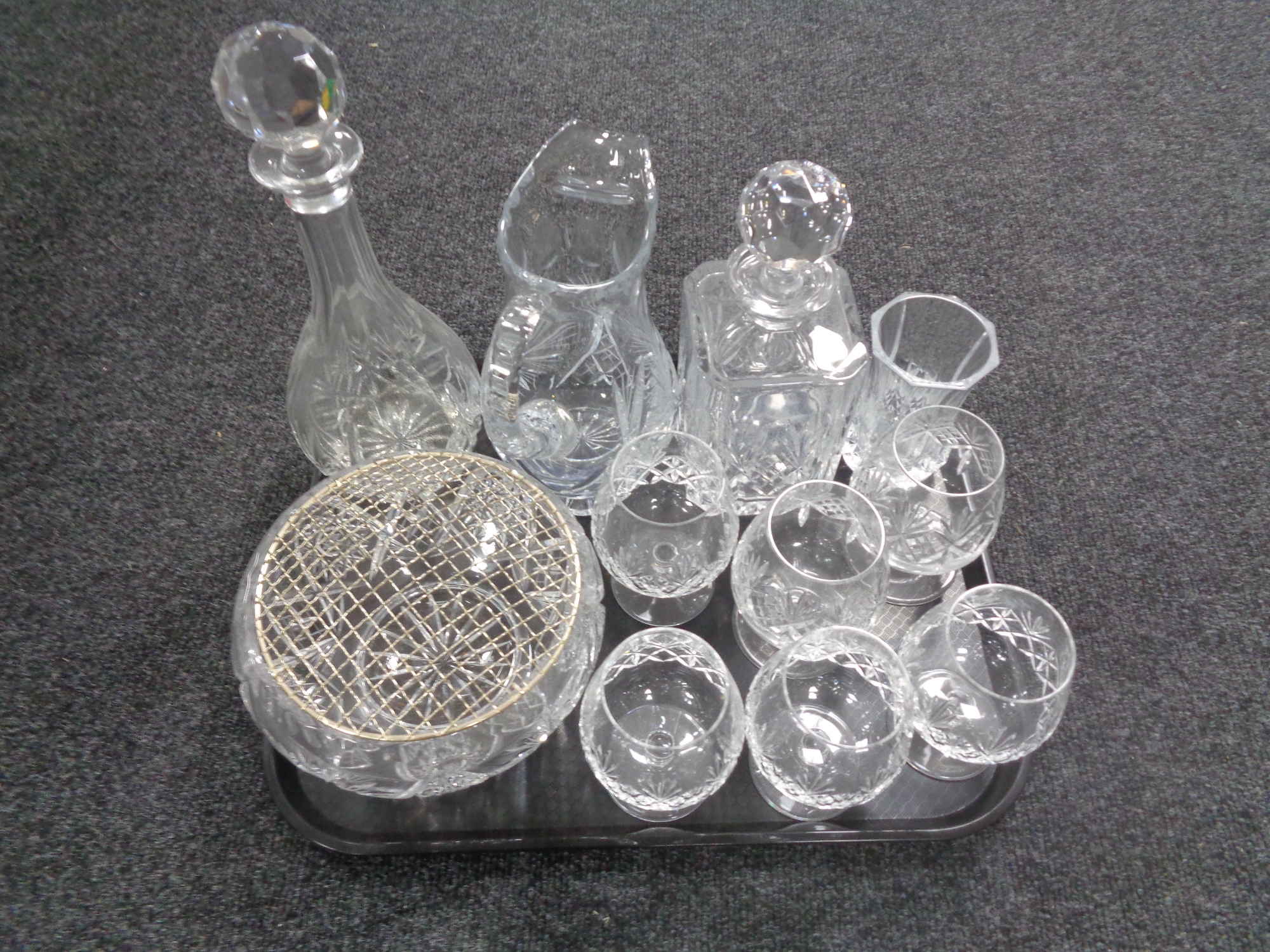 A tray containing assorted glassware to include lead crystal whiskey decanter, jug, rose bowl,