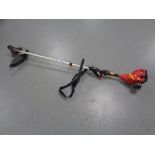 An Homelite petrol garden strimmer