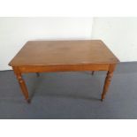 An antique pine kitchen table