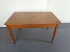 An antique pine kitchen table