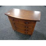 A miniature Victorian style apprentice piece five drawer chest, height 31 cm, width 36 cm.