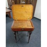 A 19th century inlaid walnut ebonised work table