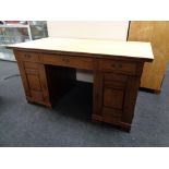 An early 20th century oak twin pedestal desk.