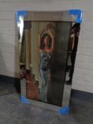 A framed print, female in a blue dress with added glitter decoration,