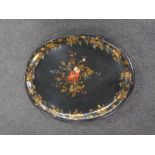 A Victorian papier mache tray with hand painted floral and grape leaf decoration (losses)