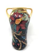 A modern Moorcroft spider webs and butterflies patterned twin-handled vase, impressed marks,