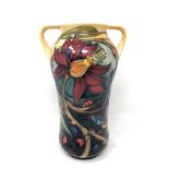 A modern Moorcroft spider webs and butterflies patterned twin-handled vase, impressed marks,